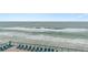 Oceanfront balcony with lounge chairs and breathtaking ocean view at 3311 S Atlantic Ave # 304, Daytona Beach Shores, FL 32118