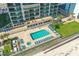 Resort-style pool with spacious deck, hot tub, and ample lounge chairs at 3311 S Atlantic Ave # 304, Daytona Beach Shores, FL 32118