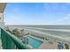 Aerial view of oceanfront pool and sundeck with lounge chairs at 3311 S Atlantic Ave # 304, Daytona Beach Shores, FL 32118