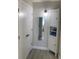 Clean bathroom with linen cabinet and mirror at 3555 S Atlantic Ave. Ave # 107, Daytona Beach Shores, FL 32118