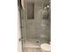 Modern shower with marble tile and glass enclosure at 3555 S Atlantic Ave. Ave # 107, Daytona Beach Shores, FL 32118