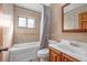 Bathroom featuring a bathtub, toilet and wood vanity at 412 Maryland Ter, Deland, FL 32724