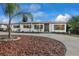 Newly renovated home with a circular driveway and attractive landscaping at 412 Maryland Ter, Deland, FL 32724