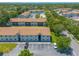 Aerial view of community highlighting building arrangement and landscaping at 415 Banana Cay Dr # F, South Daytona, FL 32119