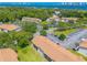 Wide aerial view of community near waterfront with ample parking at 415 Banana Cay Dr # F, South Daytona, FL 32119
