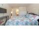 Main bedroom with queen bed and access to bathroom at 415 Banana Cay Dr # F, South Daytona, FL 32119