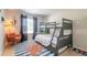 Bedroom with a bunk bed and colorful rug at 415 Banana Cay Dr # F, South Daytona, FL 32119