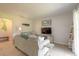 Living room with light colored sofa and flat screen TV at 415 Banana Cay Dr # F, South Daytona, FL 32119
