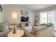Bright living room with comfy sofas and access to a patio at 415 Banana Cay Dr # F, South Daytona, FL 32119