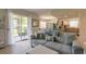 Living area with view into kitchen and access to patio at 415 Banana Cay Dr # F, South Daytona, FL 32119