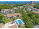 Community pool with ample lounge chairs, offering a relaxing space at 415 Banana Cay Dr # F, South Daytona, FL 32119