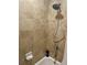 Bathroom with shower and tiled walls at 5300 S Atlantic Ave # 19-502, New Smyrna Beach, FL 32169