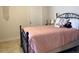 Bedroom with a comfortable bed and soft pink bedding at 5300 S Atlantic Ave # 19-502, New Smyrna Beach, FL 32169