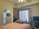 Bedroom with large window and built-in workspace at 5300 S Atlantic Ave # 19-502, New Smyrna Beach, FL 32169