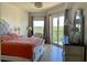 Bright bedroom with king bed and water view at 5300 S Atlantic Ave # 19-502, New Smyrna Beach, FL 32169