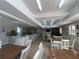 Community room with tables, chairs, and a kitchen area at 5300 S Atlantic Ave # 19-502, New Smyrna Beach, FL 32169