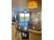 Elegant dining room with a round table and chandelier at 5300 S Atlantic Ave # 19-502, New Smyrna Beach, FL 32169