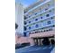 Exterior view of condo building with parking garage at 5300 S Atlantic Ave # 19-502, New Smyrna Beach, FL 32169