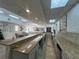 Modern community kitchen with granite countertops at 5300 S Atlantic Ave # 19-502, New Smyrna Beach, FL 32169