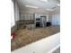 Well-equipped community kitchen featuring granite counters at 5300 S Atlantic Ave # 19-502, New Smyrna Beach, FL 32169