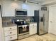 Modern kitchen with stainless steel appliances and granite countertops at 5300 S Atlantic Ave # 19-502, New Smyrna Beach, FL 32169