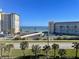 Ocean view from condo building, parking, tennis court at 5300 S Atlantic Ave # 19-502, New Smyrna Beach, FL 32169