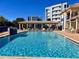 Inviting resort-style pool with lounge chairs at 5300 S Atlantic Ave # 19-502, New Smyrna Beach, FL 32169