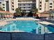 Relaxing pool area with shaded seating at 5300 S Atlantic Ave # 19-502, New Smyrna Beach, FL 32169