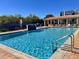 Inviting resort-style pool with a waterfall feature at 5300 S Atlantic Ave # 19-502, New Smyrna Beach, FL 32169