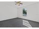 Well lit bedroom with ceiling fan and large window at 552 Nardello Dr, Deltona, FL 32725