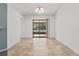 Spacious dining area with tile floors and sliding glass doors to patio at 552 Nardello Dr, Deltona, FL 32725