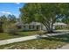 Single-story house with a large tree in front and a sidewalk at 552 Nardello Dr, Deltona, FL 32725