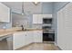 Modern kitchen, stainless steel appliances and white cabinets at 552 Nardello Dr, Deltona, FL 32725