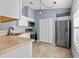 Updated kitchen with stainless steel appliances and light cabinets at 552 Nardello Dr, Deltona, FL 32725