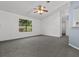Bright living room with gray carpet and ceiling fan at 552 Nardello Dr, Deltona, FL 32725