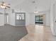 Spacious living room with gray carpeting and tile floors at 552 Nardello Dr, Deltona, FL 32725