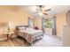 Main bedroom with a queen bed and ceiling fan at 75 Jennifer Cir, Ponce Inlet, FL 32127