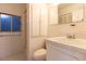 Simple bathroom with shower, toilet and vanity at 1068 North St, Daytona Beach, FL 32114