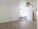 Main bedroom with window seat and vinyl plank flooring at 1068 North St, Daytona Beach, FL 32114