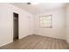 Bedroom with wood-look floors and a window at 1068 North St, Daytona Beach, FL 32114