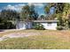 Light blue ranch house with a one car garage at 1068 North St, Daytona Beach, FL 32114