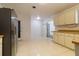 Kitchen features ample cabinet space and stainless steel refrigerator at 1068 North St, Daytona Beach, FL 32114