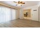 Living area with vinyl plank flooring and sliding glass doors at 1068 North St, Daytona Beach, FL 32114