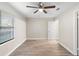 Well-lit bedroom with ceiling fan and wood-look flooring at 1422 W Kaley Ave, Orlando, FL 32805