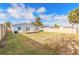 Large backyard with wooden fence and deck at 1631 Granada Ave, Daytona Beach, FL 32117