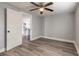 Bright bedroom with wood-look floors and view of kitchen at 1631 Granada Ave, Daytona Beach, FL 32117