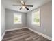 Bright bedroom with new flooring and ceiling fan at 1631 Granada Ave, Daytona Beach, FL 32117
