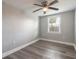Bright bedroom with new flooring and ceiling fan at 1631 Granada Ave, Daytona Beach, FL 32117
