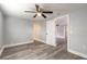 Bedroom with new flooring, ceiling fan and built-in closet at 1631 Granada Ave, Daytona Beach, FL 32117