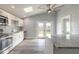 Modern kitchen with white cabinets, stainless steel appliances, and a skylight at 1631 Granada Ave, Daytona Beach, FL 32117